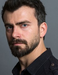 Толга Искит